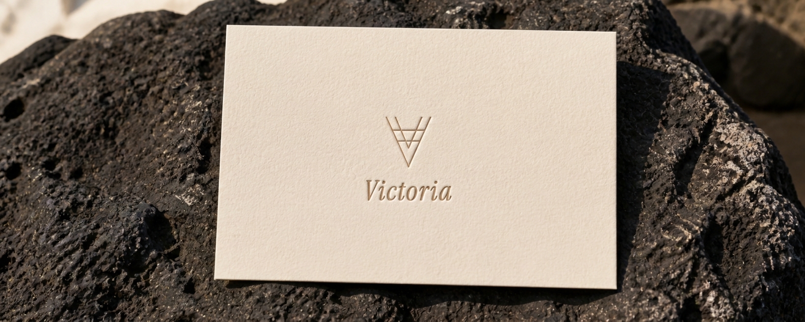 Victoria welcome card placed in volcanic-stone dish at reception